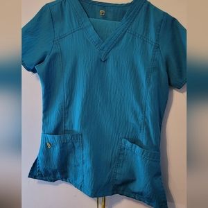 Wonderwink scrubs in excellent used condition. Turquiose in color, Size small
